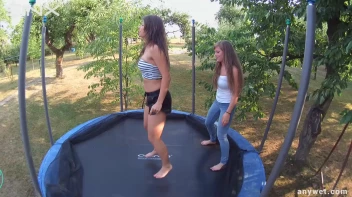 Cute Brunettes Get Drenched On Trampoline Screencap 11 on sinx.preview.netperv.com