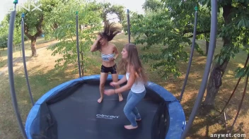 Cute Brunettes Get Drenched On Trampoline Screencap 12 on sinx.preview.netperv.com