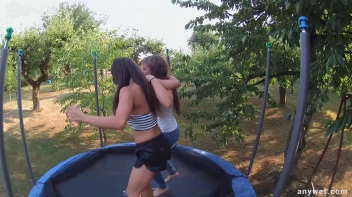 Cute Brunettes Get Drenched On Trampoline Screencap 16 on sinx.preview.netperv.com