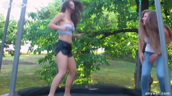 Cute Brunettes Get Drenched On Trampoline Screencap 2 on sinx.preview.netperv.com