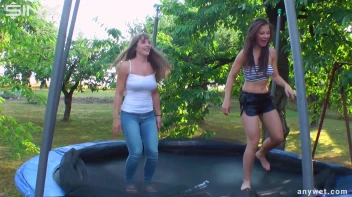 Cute Brunettes Get Drenched On Trampoline Screencap 20 on sinx.preview.netperv.com