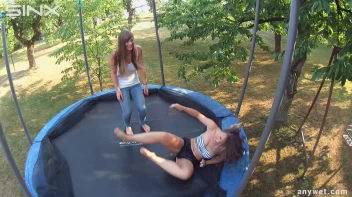 Cute Brunettes Get Drenched On Trampoline Screencap 22 on sinx.preview.netperv.com