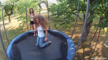 Cute Brunettes Get Drenched On Trampoline Screencap 28 on sinx.preview.netperv.com