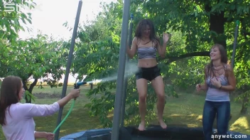 Cute Brunettes Get Drenched On Trampoline Screencap 42 on sinx.preview.netperv.com