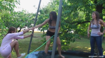 Cute Brunettes Get Drenched On Trampoline Screencap 45 on sinx.preview.netperv.com