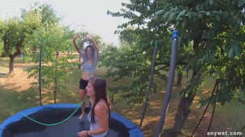 Cute Brunettes Get Drenched On Trampoline Screencap 54 on sinx.preview.netperv.com