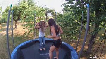 Cute Brunettes Get Drenched On Trampoline Screencap 8 on sinx.preview.netperv.com