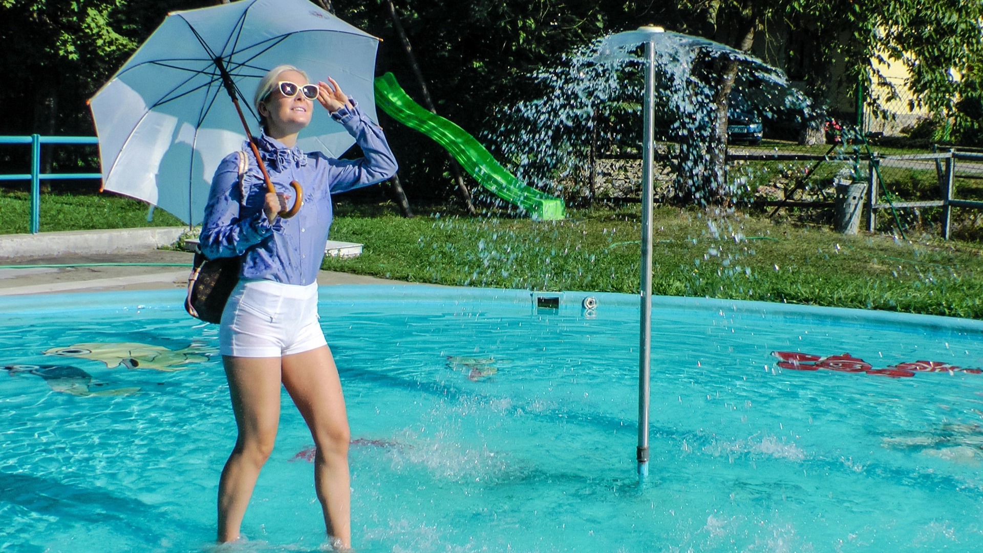 Playful Blonde Gets Drenched Under Water Fountain on sinx.preview.netperv.com