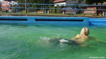 Sexy Blonde Swims And Splashes In Outdoor Pool Screencap 21 on sinx.preview.netperv.com
