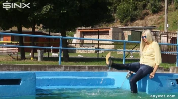 Sexy Blonde Swims And Splashes In Outdoor Pool Screencap 7 on sinx.preview.netperv.com