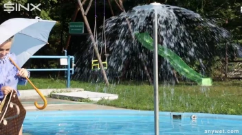 Playful Blonde Gets Drenched Under Water Fountain Screencap 13 on sinx.preview.netperv.com