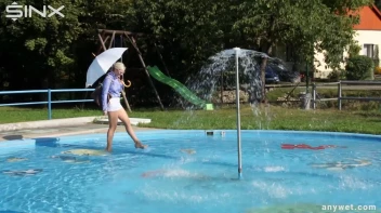 Playful Blonde Gets Drenched Under Water Fountain Screencap 2 on sinx.preview.netperv.com