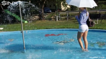 Playful Blonde Gets Drenched Under Water Fountain Screencap 6 on sinx.preview.netperv.com