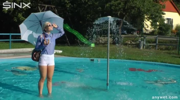 Playful Blonde Gets Drenched Under Water Fountain Screencap 10 on sinx.preview.netperv.com