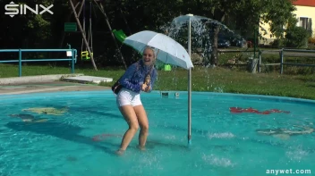 Playful Blonde Gets Drenched Under Water Fountain Screencap 11 on sinx.preview.netperv.com