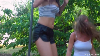 Cute Brunettes Get Drenched On Trampoline Screencap 1 on sinx.preview.netperv.com