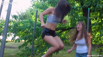 Cute Brunettes Get Drenched On Trampoline Screencap 10 on sinx.preview.netperv.com