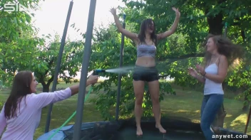 Cute Brunettes Get Drenched On Trampoline Screencap 41 on sinx.preview.netperv.com