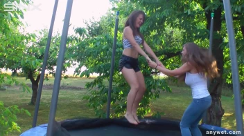Cute Brunettes Get Drenched On Trampoline Screencap 5 on sinx.preview.netperv.com