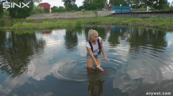 Seductive Blonde Smokes And Gets Drenched In Lake Screencap 10 on sinx.preview.netperv.com