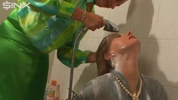 Fully Dressed Ladies Wash Their Hair Together Screencap 36 on sinx.preview.netperv.com