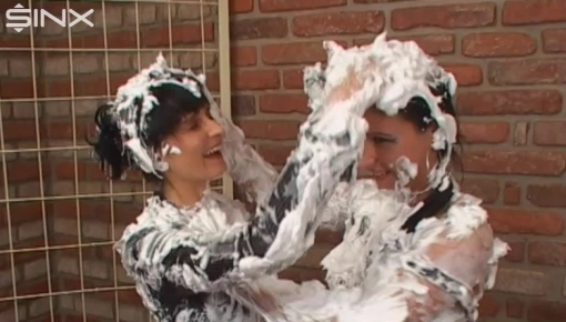 Two raven haired babes are in the moo...