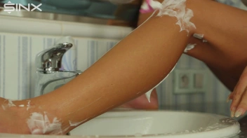 Stunning European Shaves Her Legs In The Sink Screencap 36 on sinx.preview.netperv.com